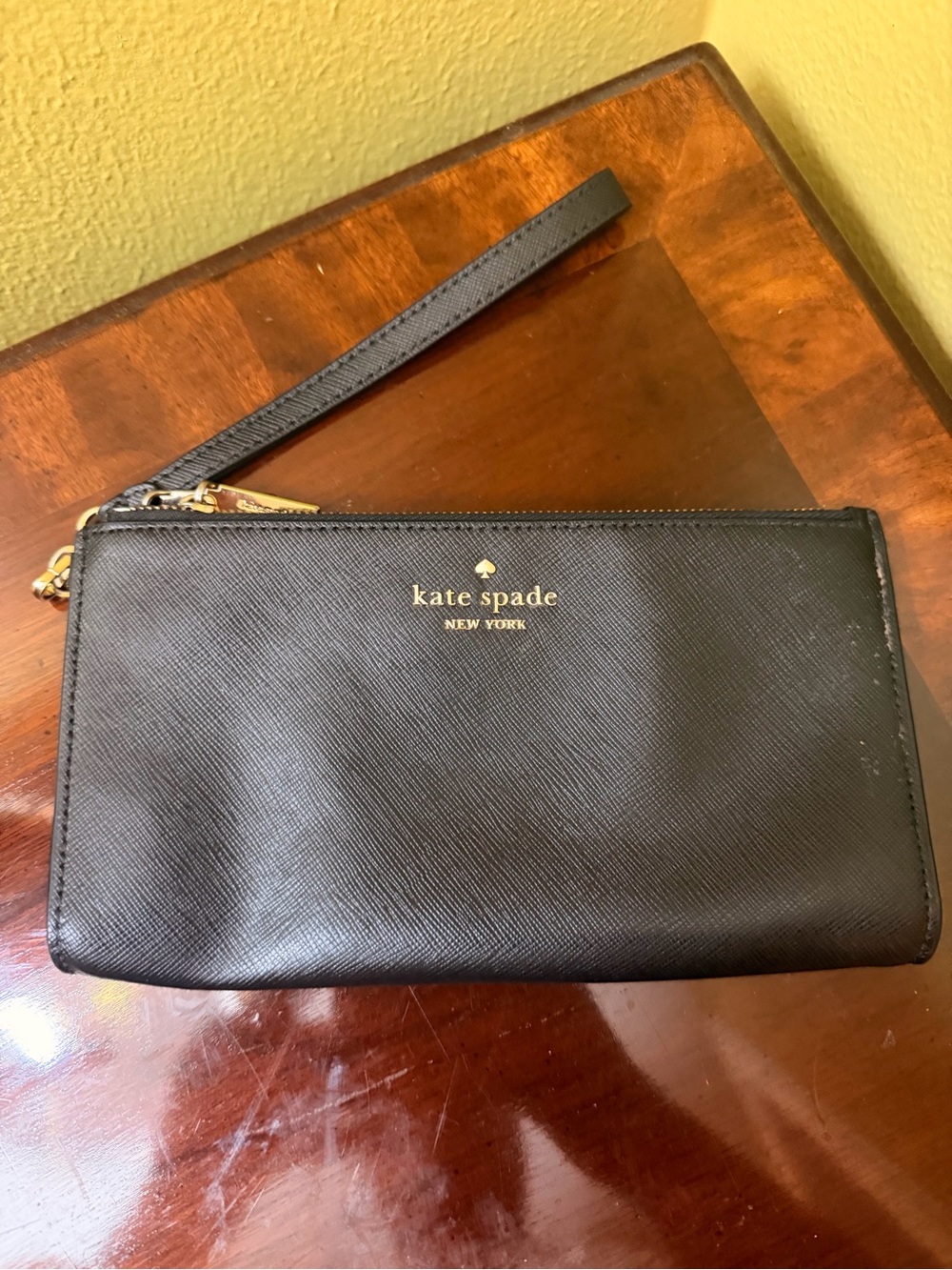 Kate Spade black leather Wristlet Wallet with gold logo